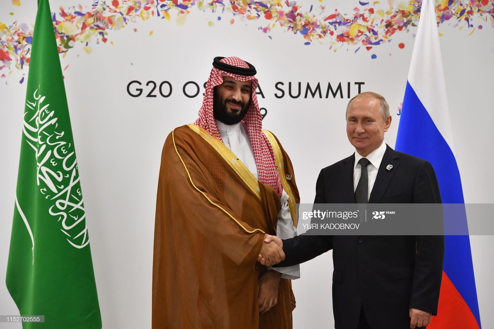 Russia's President Vladimir Putin (R) shakes hands with Saudi Arabia's Crown Prince Mohammed bin Salman during a meeting on the sidelines of the G20 Summit in Osaka on June 29, 2019. (Photo by Yuri KADOBNOV / POOL / AFP) (Photo credit should read YURI KADOBNOV/AFP via Getty Images)